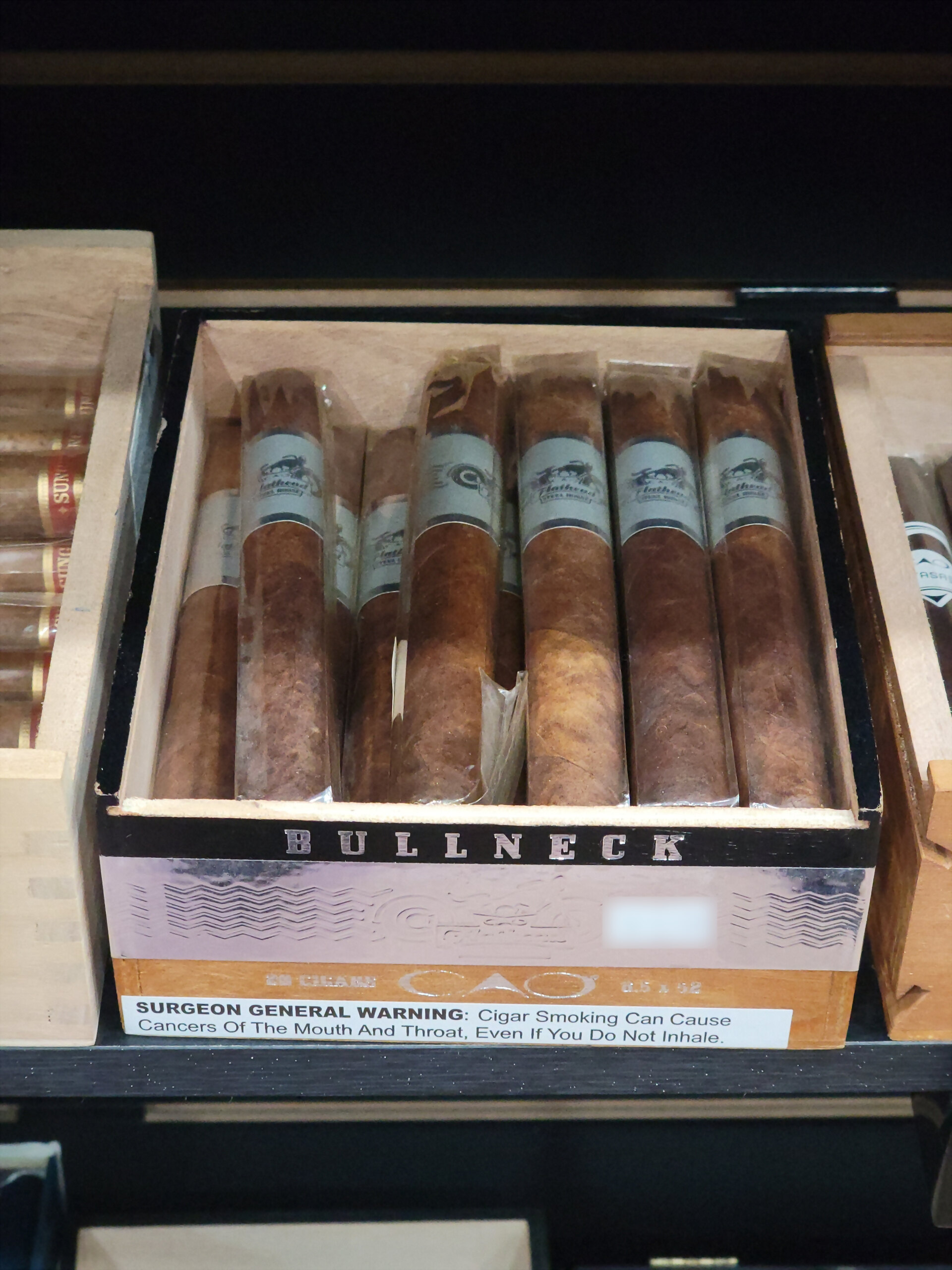 The CAO Bullneck box open from above, BULLNECK across the front rail