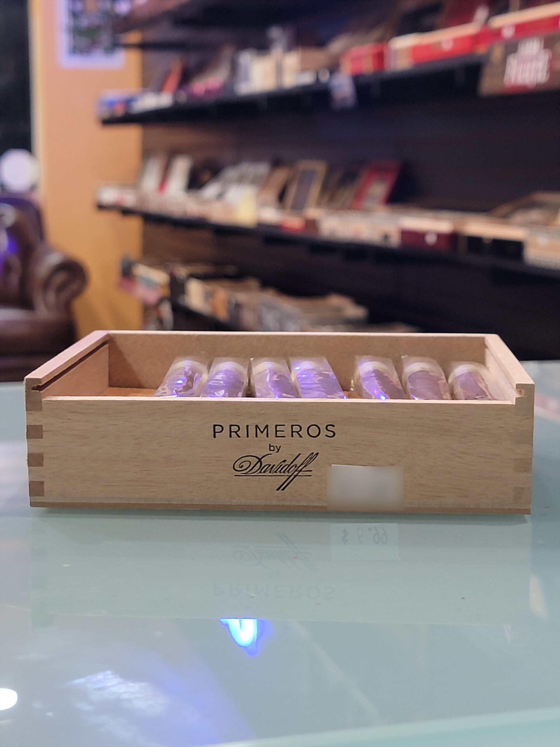 A Primeros by Davidoff box on the counter glass