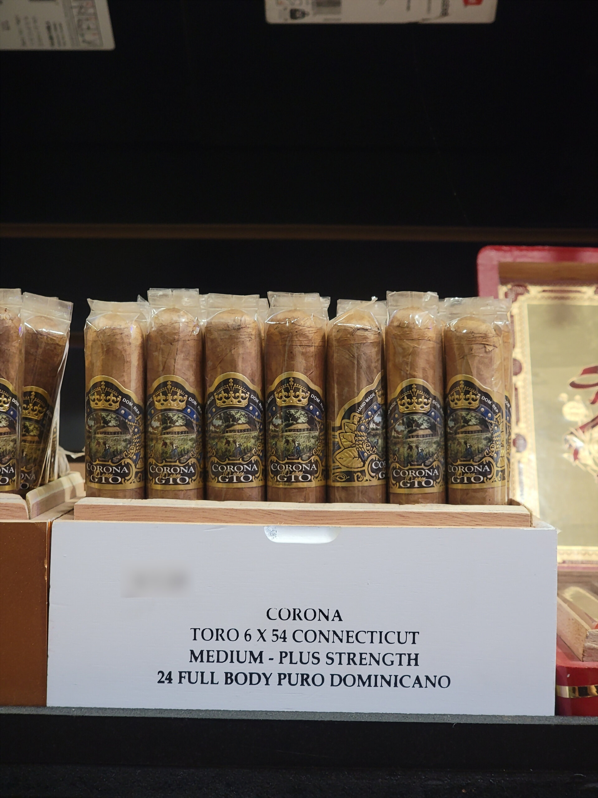 A white Corona GTO Connecticut box of toros on the humidor shelf