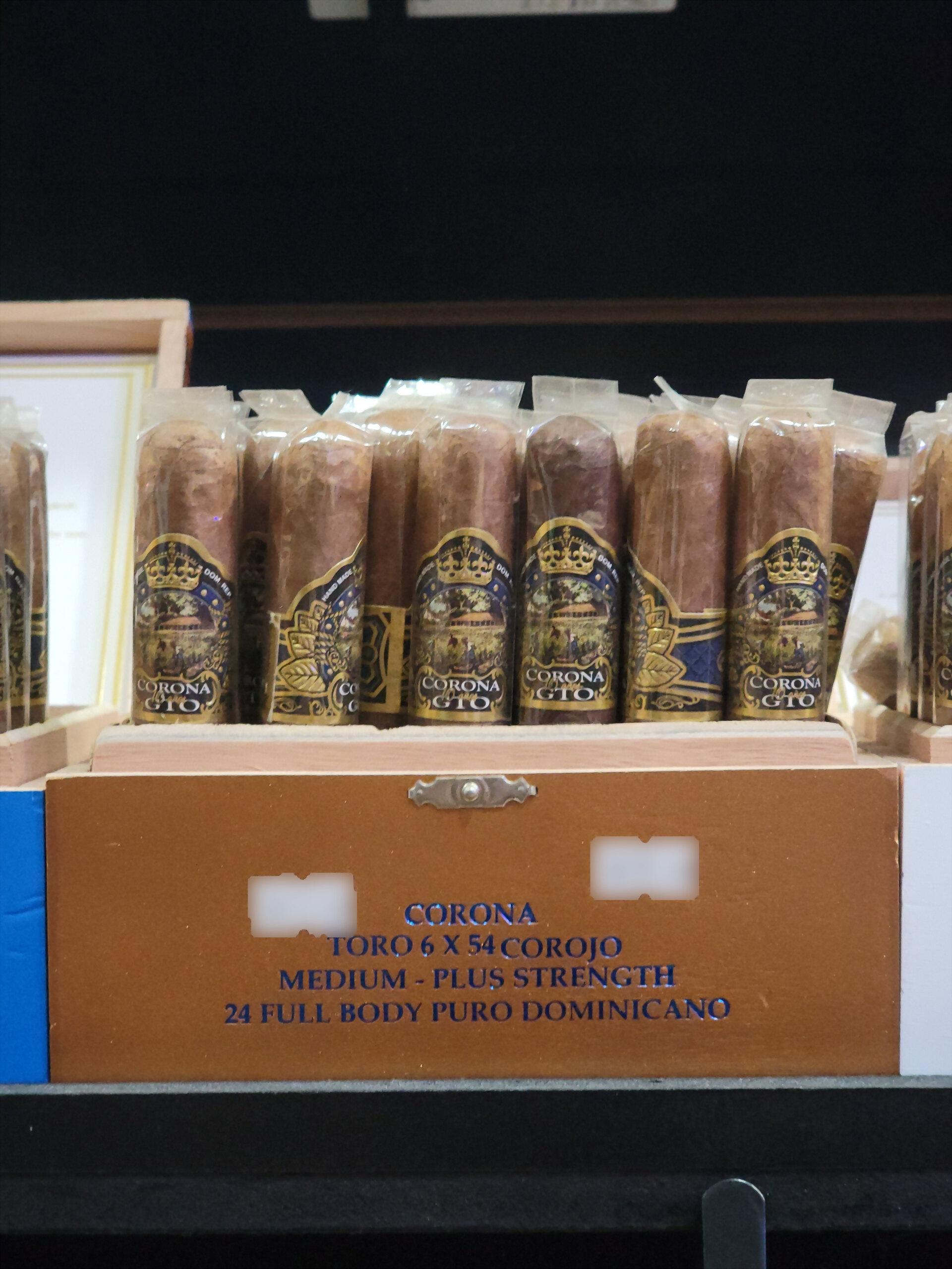 A tan Corona GTO Corojo box of toros on the humidor shelf