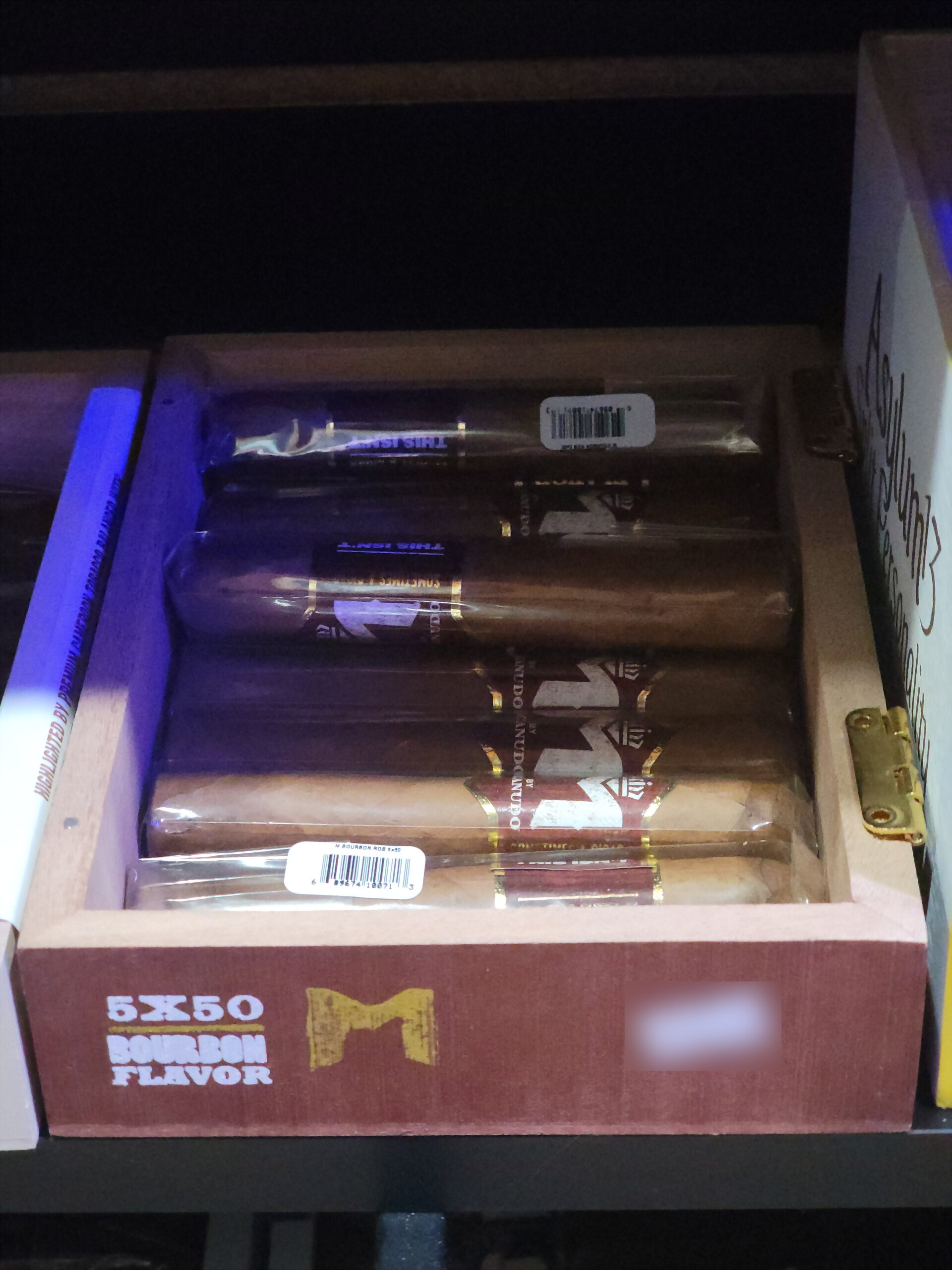 The M by Macanudo Bourbon box open, 5X50 BOURBON FLAVOR across the front