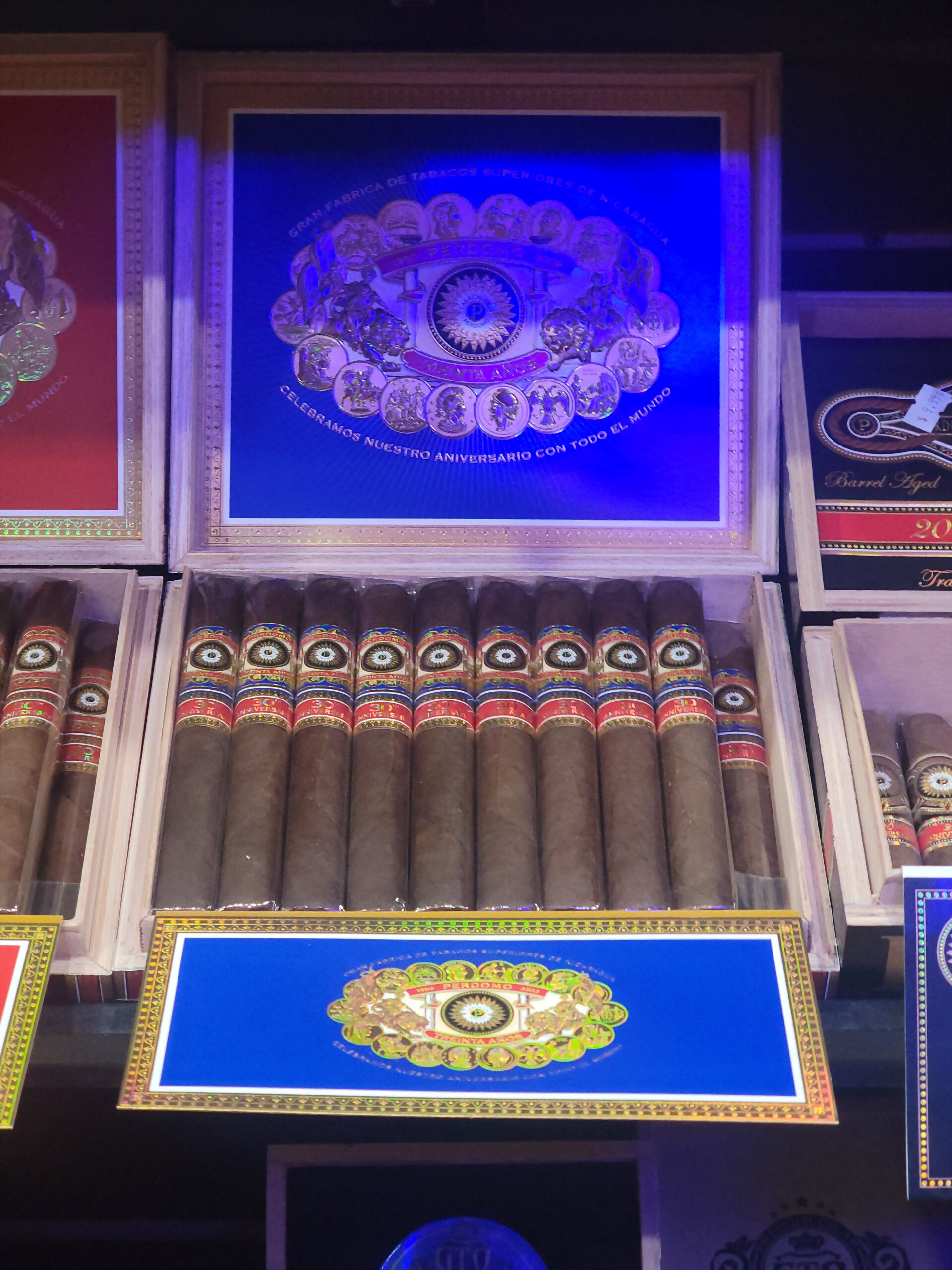 A third Perdomo Treinta Años box, the medallion on a blue inner lid