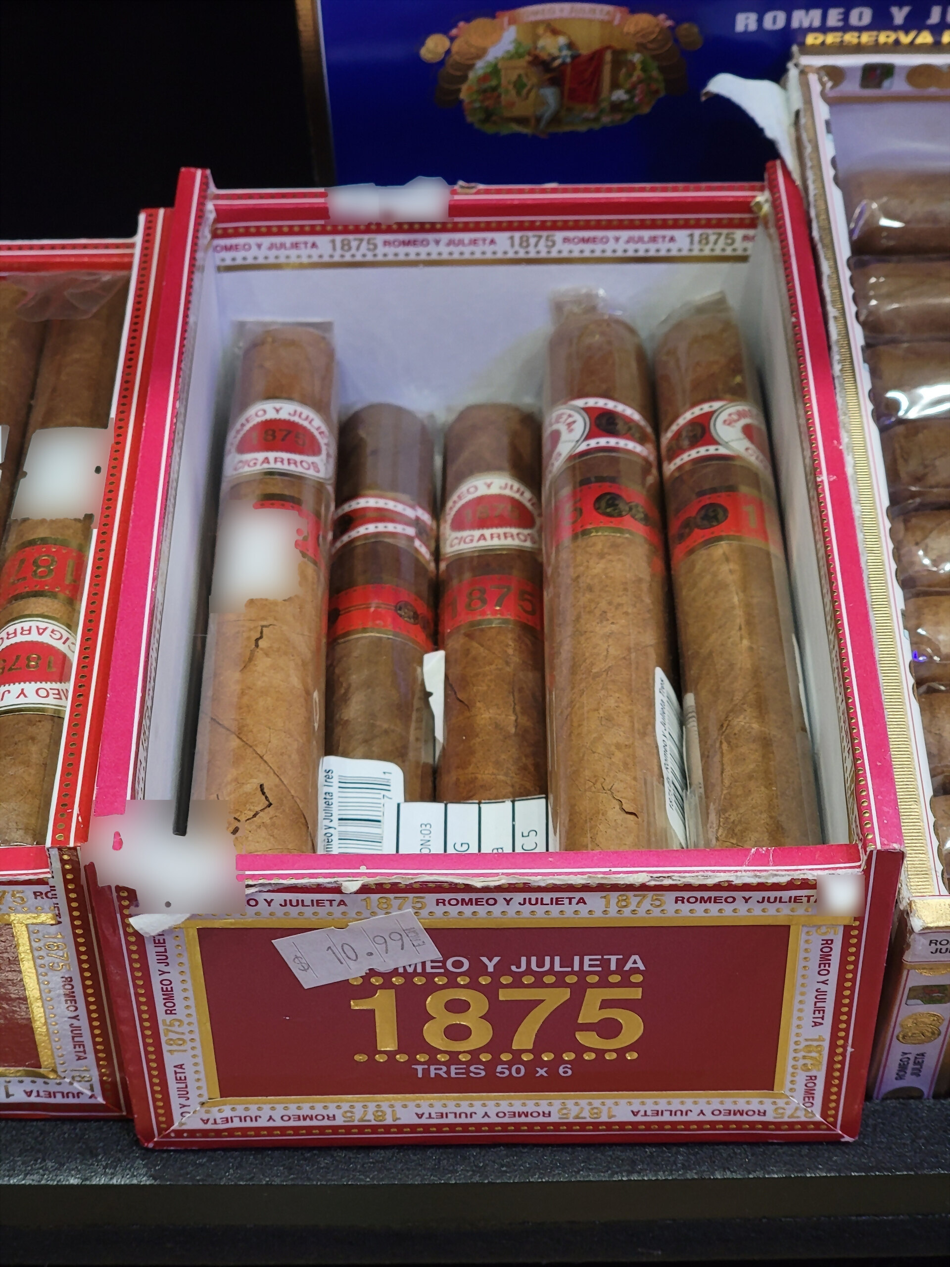 A Romeo y Julieta 1875 box, TRES 50 x 6 in gold on the red front panel