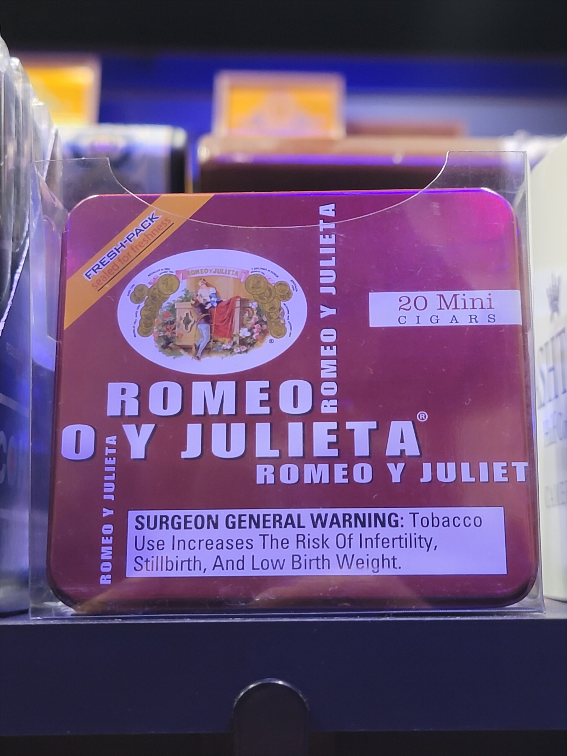 A Romeo y Julieta 20 Mini Cigars tin on the counter display