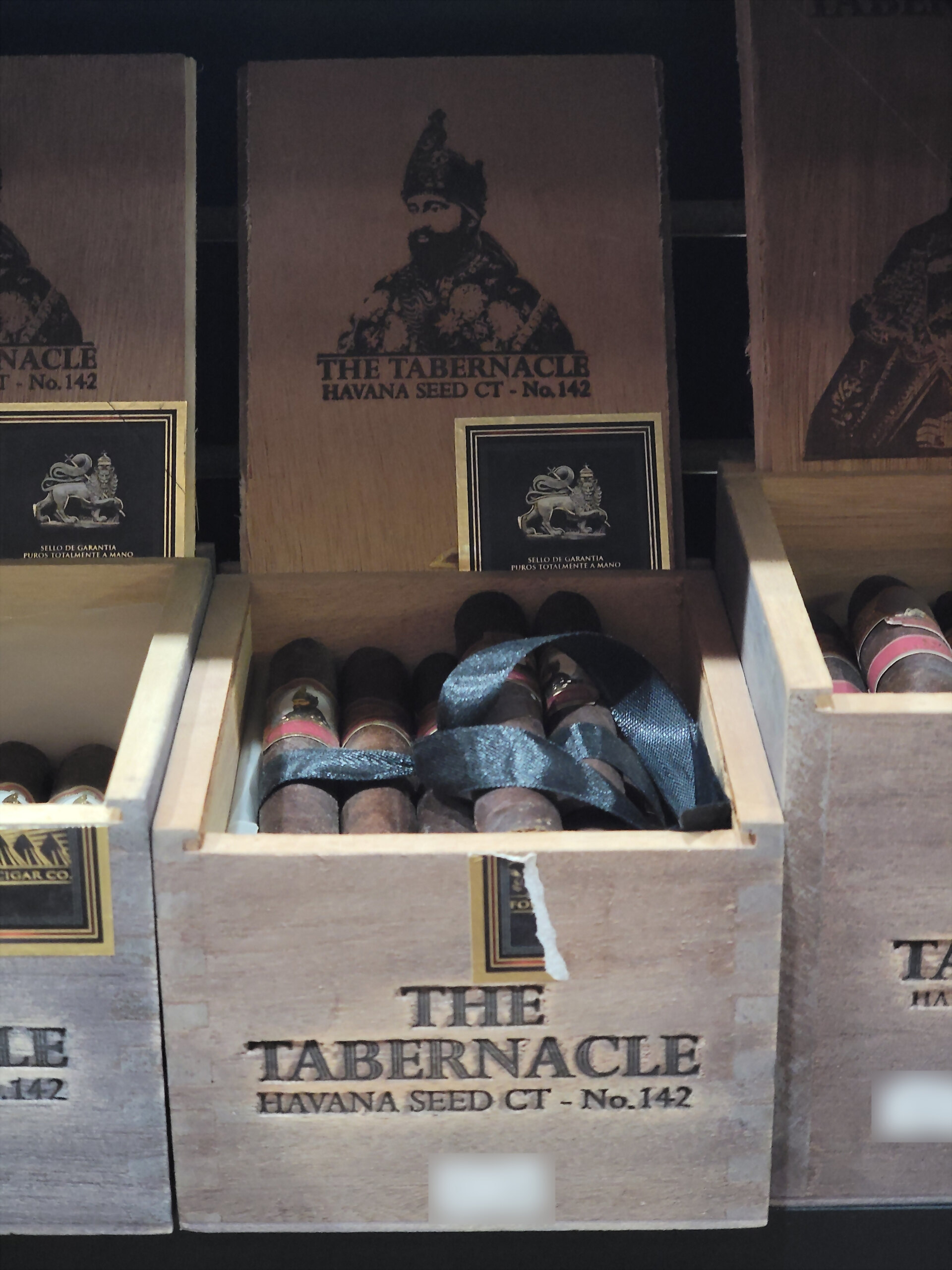 The Tabernacle Havana Seed CT No. 142 boxes stacked on the shelf behind the David box